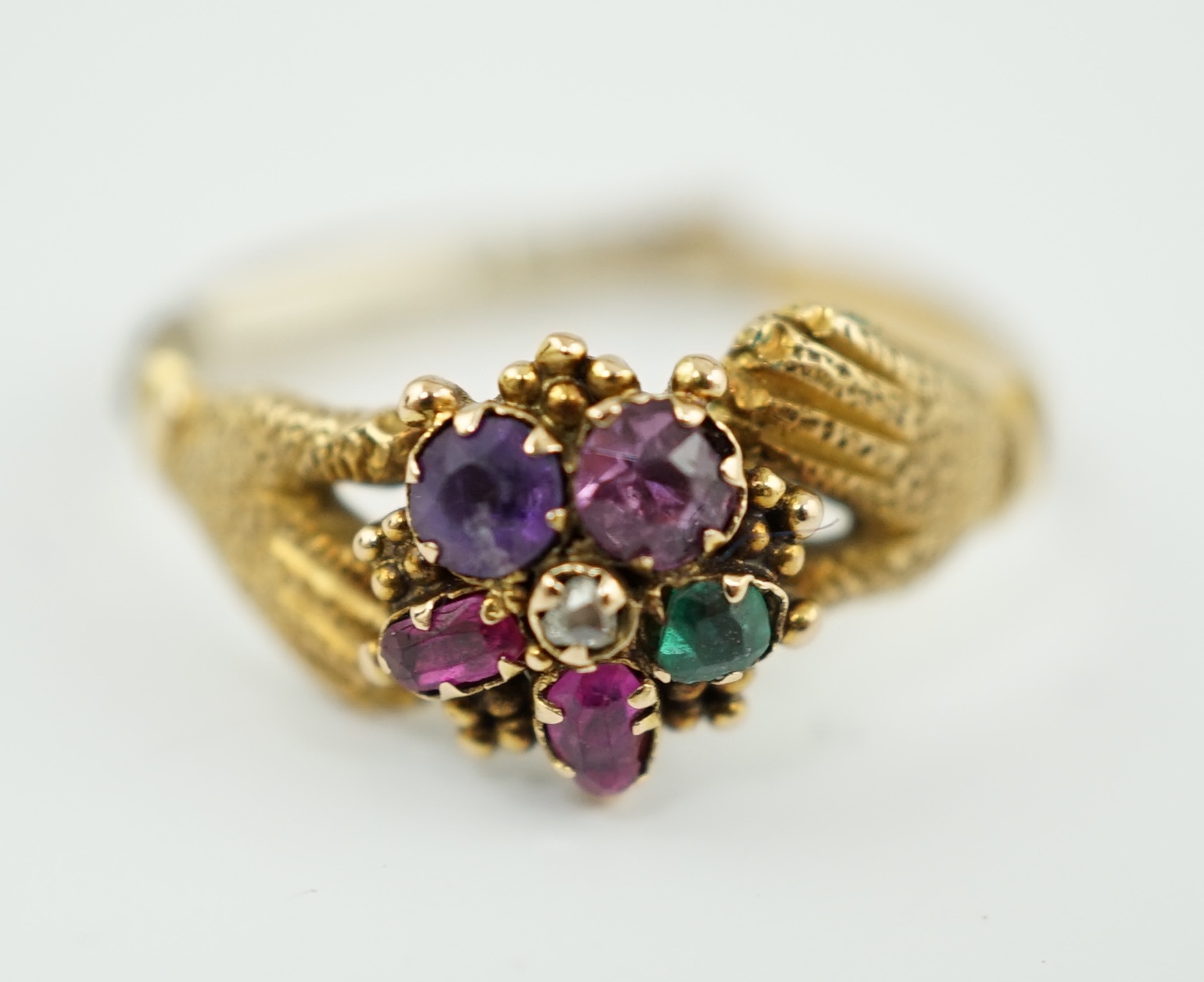 A late Victorian 15ct gold 'Regard' ring, modelled as two hands clutching a flower head, size K, together with a 15ct gold and seed pearl bar brooch, modelled as a frog upon bulrushes